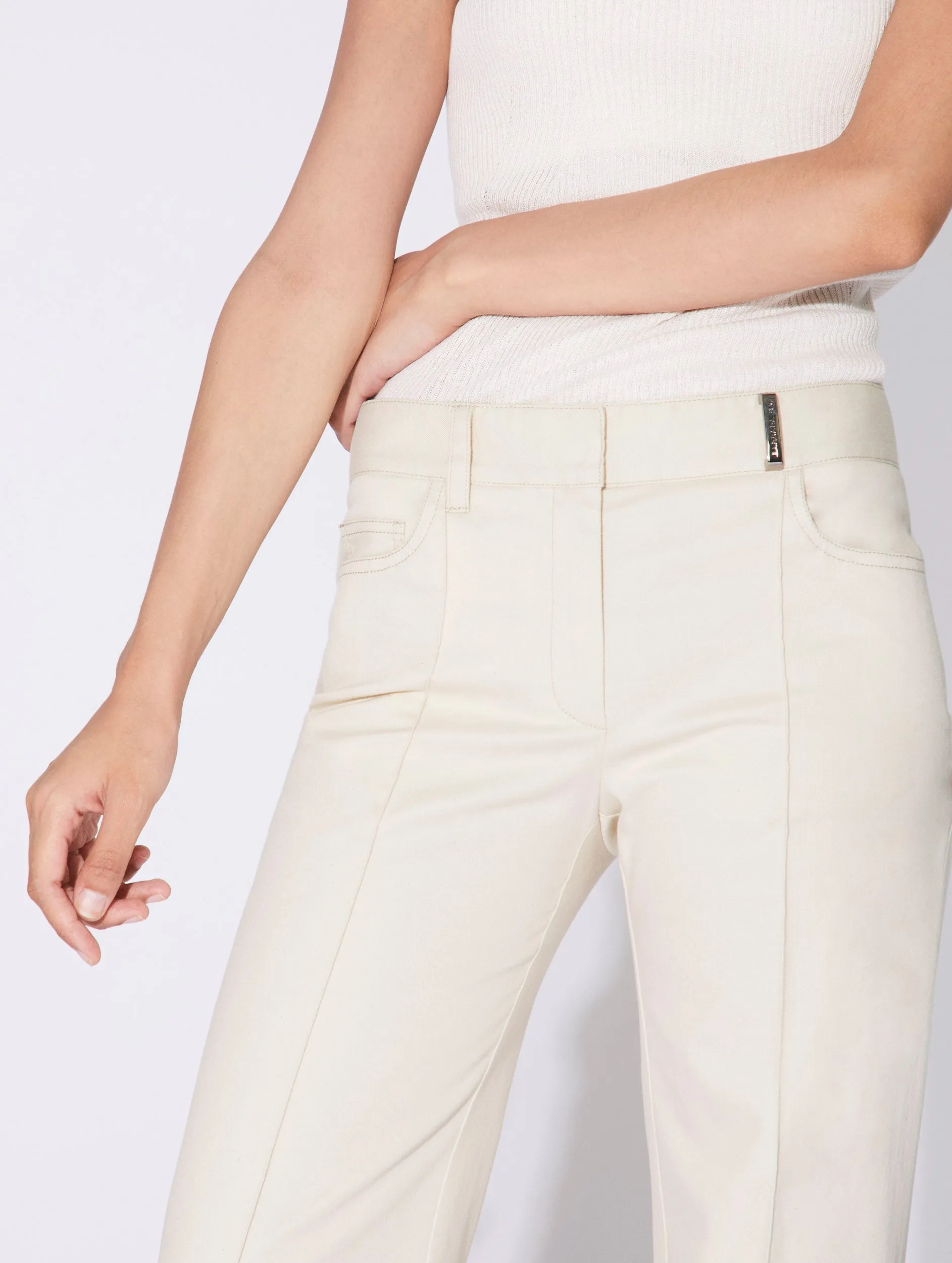 Cream washed denim flared trousers