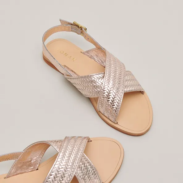 Flat sandals with broad straps in platinum metallic leather