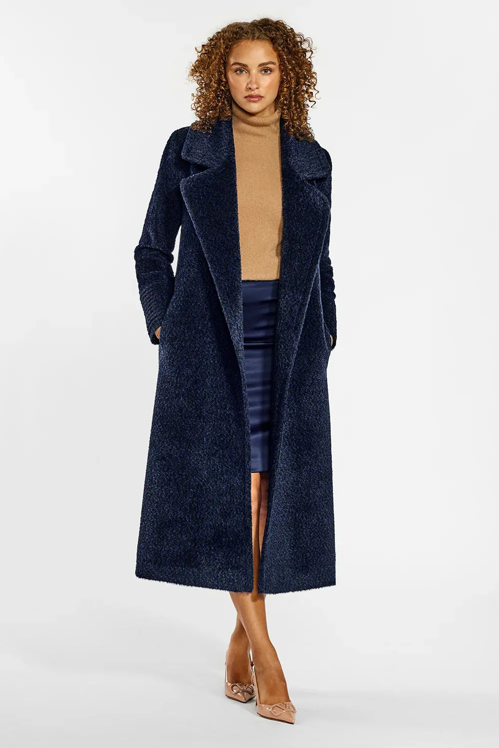 Sentaler boucle coat with long notched collar.